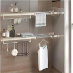 Separator telescopic extensibil pentru rafturi de dulap